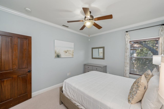 bedroom featuring light colored carpet, ceiling fan, and crown molding