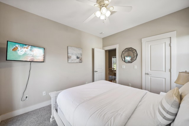 bedroom with ceiling fan and carpet floors