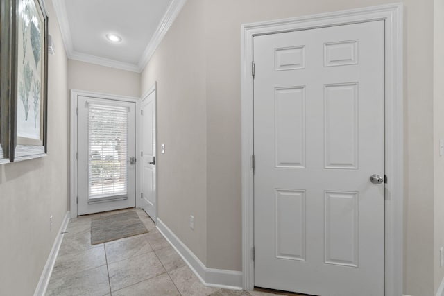 doorway featuring ornamental molding and light tile patterned floors