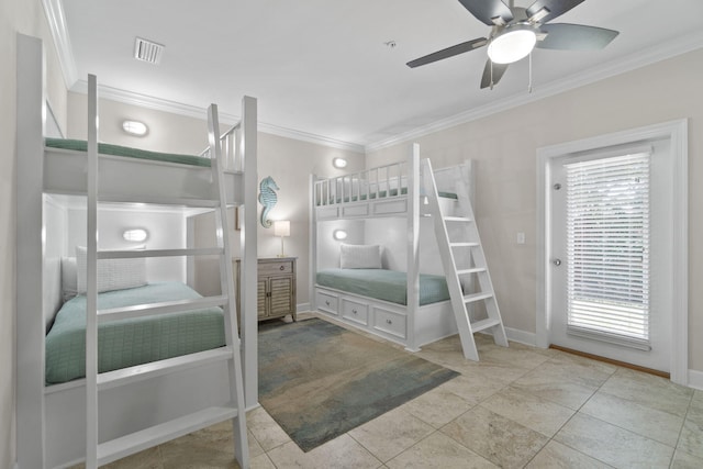 tiled bedroom featuring multiple windows, ceiling fan, and crown molding