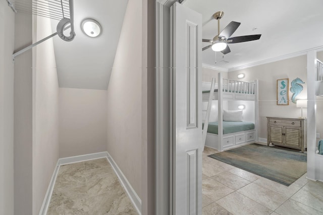 bathroom with ceiling fan and ornamental molding