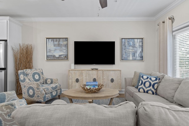 living room with wood-type flooring, ceiling fan, and ornamental molding