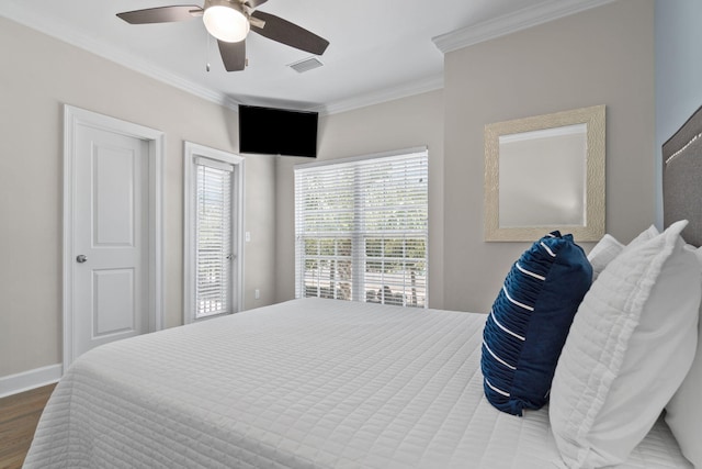 bedroom featuring wood-type flooring, ceiling fan, and crown molding