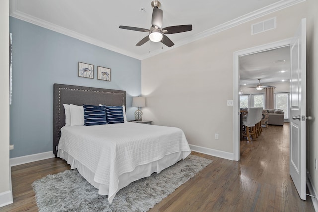 bedroom featuring crown molding, ceiling fan, and dark wood-type flooring