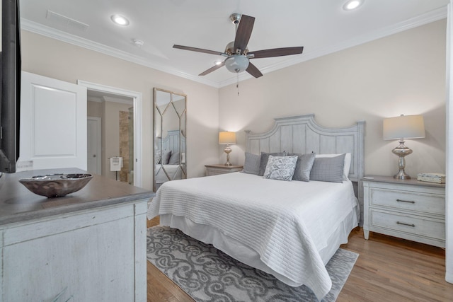 bedroom with ceiling fan, light wood-type flooring, and ornamental molding