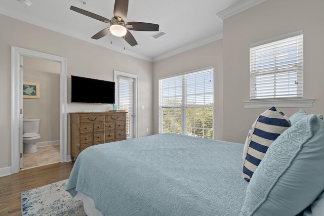 bedroom with ceiling fan, crown molding, ensuite bathroom, and light hardwood / wood-style flooring