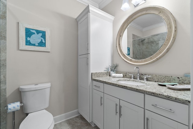 bathroom featuring crown molding, vanity, and toilet