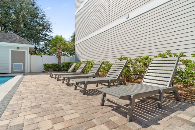 view of patio featuring a fenced in pool