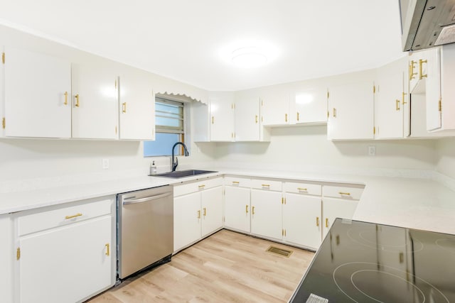 kitchen featuring light wood-style floors, white cabinets, dishwasher, and a sink