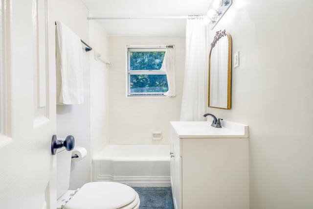 full bath featuring toilet, shower / bath combo with shower curtain, and vanity