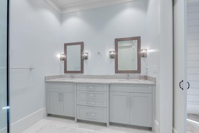 bathroom with vanity and crown molding