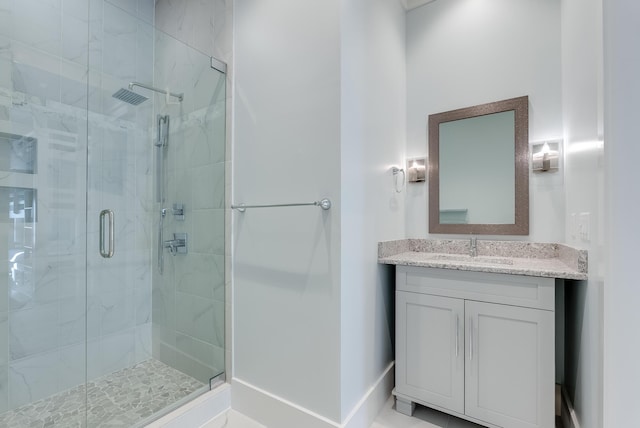 bathroom with vanity and an enclosed shower