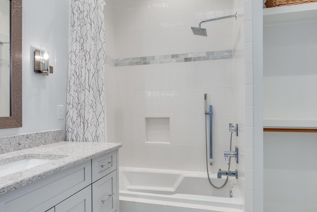 bathroom featuring shower / bath combination with curtain and vanity