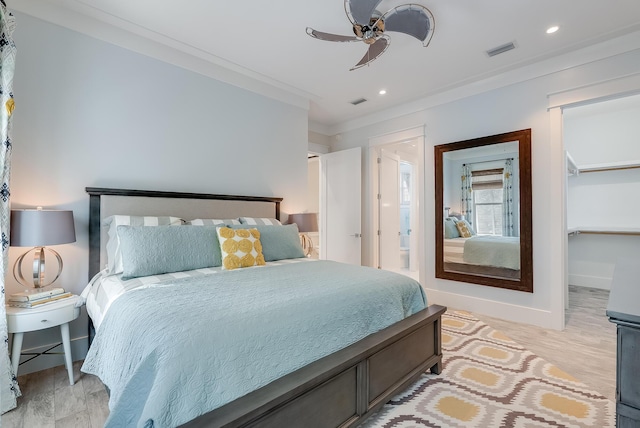 41 Tresca Lake Ct, Santa Rosa Beach, FL 32459 - bedroom with ornamental molding, ceiling fan, light wood finished floors, a walk in closet, and recessed lighting