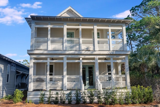 view of front of home featuring central AC, french doors, and a porch