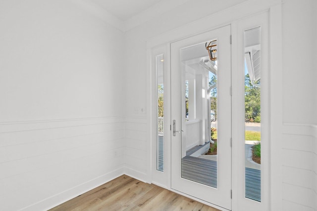 entryway with wood finished floors