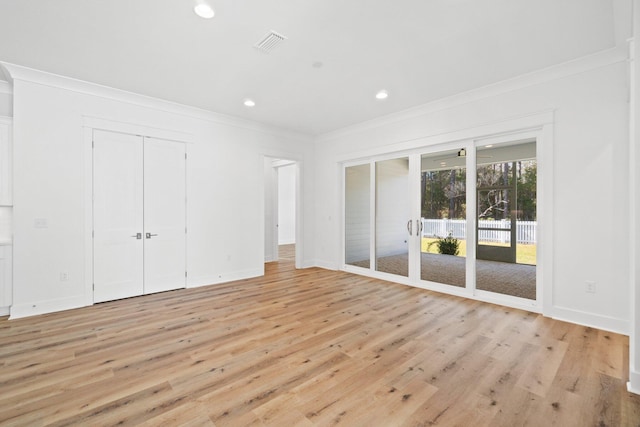 unfurnished bedroom with access to exterior, light hardwood / wood-style floors, and ornamental molding