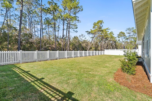 view of yard with a fenced backyard