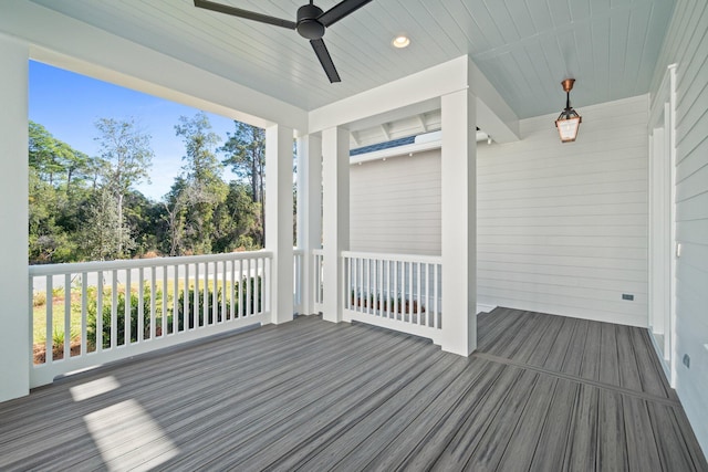 unfurnished sunroom featuring a ceiling fan