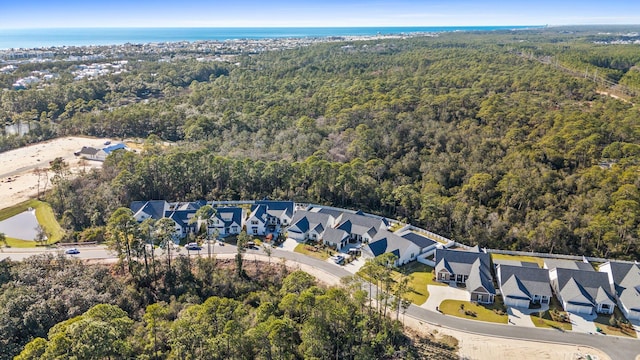 aerial view featuring a residential view and a forest view