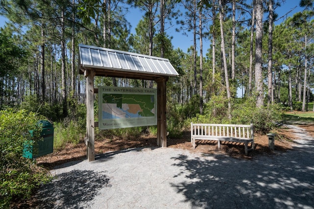 surrounding community featuring a forest view