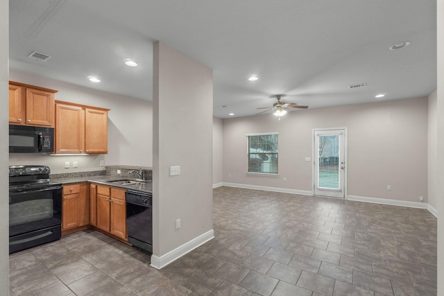 kitchen featuring ceiling fan, sink, and black appliances