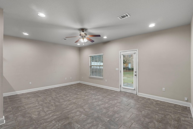 empty room featuring ceiling fan