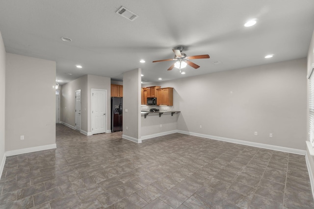 unfurnished living room featuring ceiling fan