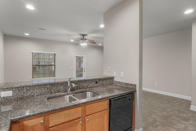 kitchen featuring ceiling fan, black dishwasher, dark stone counters, and sink