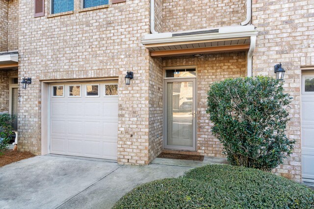 doorway to property featuring a garage