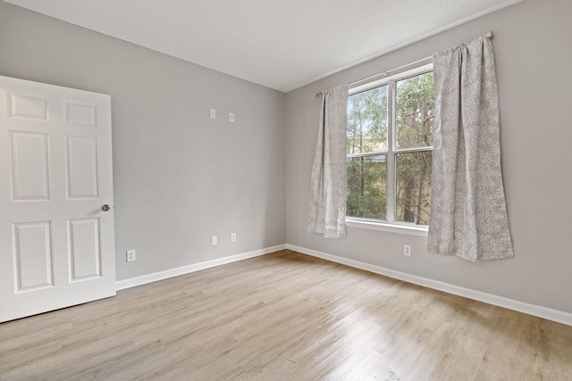 unfurnished room featuring light wood-type flooring