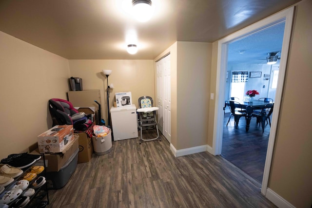 laundry area featuring dark hardwood / wood-style floors, ceiling fan, and washer / clothes dryer