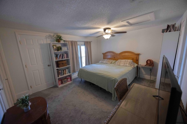 carpeted bedroom featuring ceiling fan and a textured ceiling