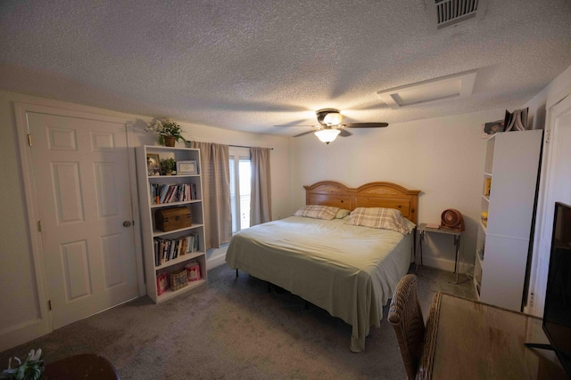 bedroom with carpet flooring, ceiling fan, and a textured ceiling