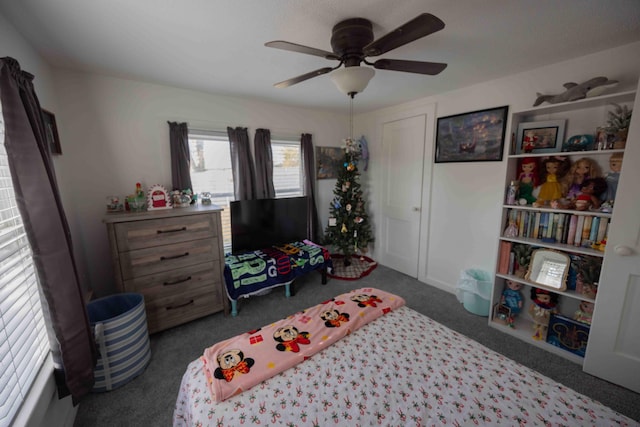 carpeted bedroom with ceiling fan