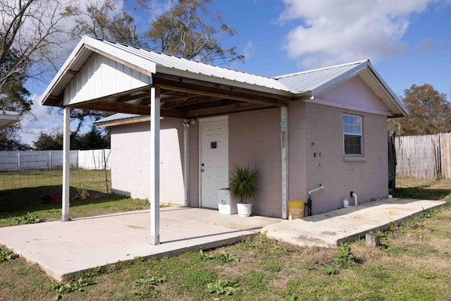 back of property featuring a yard