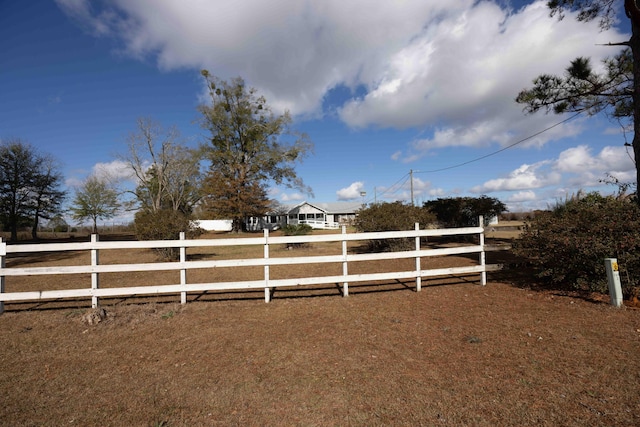 view of yard with a rural view