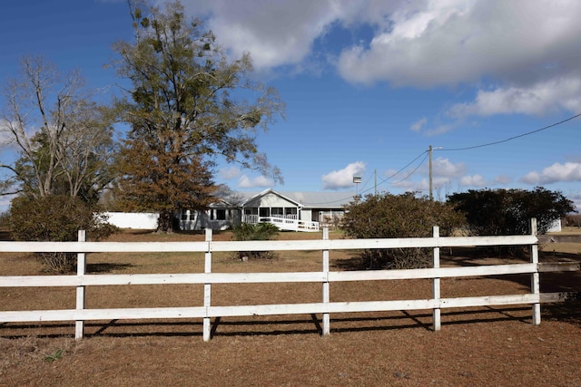 view of yard with a rural view