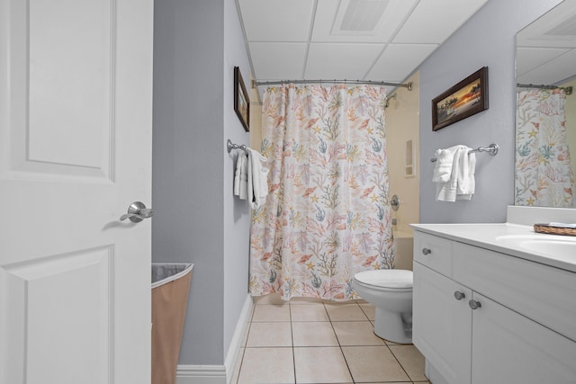 full bathroom with shower / tub combo, a paneled ceiling, tile patterned floors, vanity, and toilet