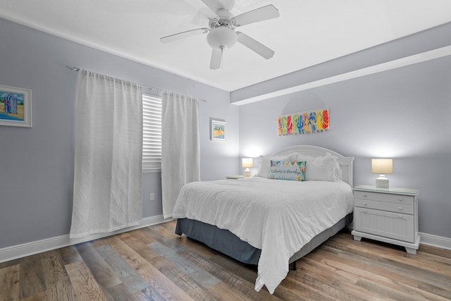 bedroom with ceiling fan and hardwood / wood-style floors