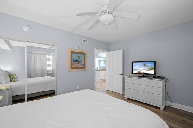 bedroom with ceiling fan and dark hardwood / wood-style floors