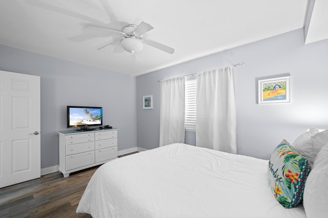 bedroom featuring dark hardwood / wood-style floors and ceiling fan