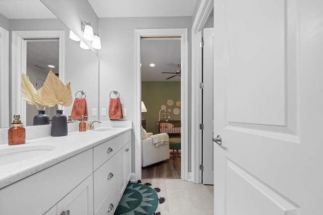 bathroom with ceiling fan, vanity, and tile patterned flooring