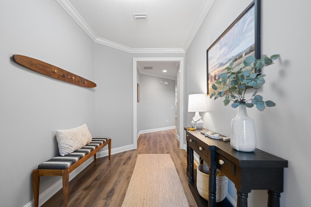 corridor with ornamental molding and dark hardwood / wood-style flooring