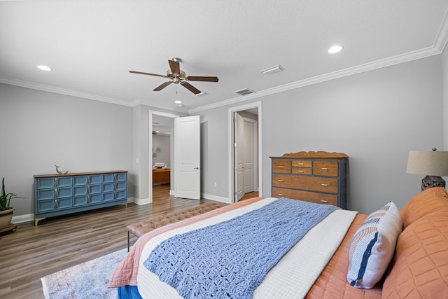 bedroom featuring ceiling fan, dark wood-type flooring, and crown molding