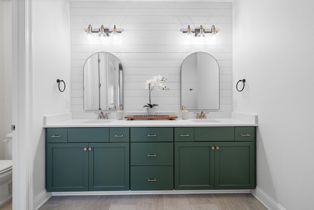 bathroom featuring toilet and vanity