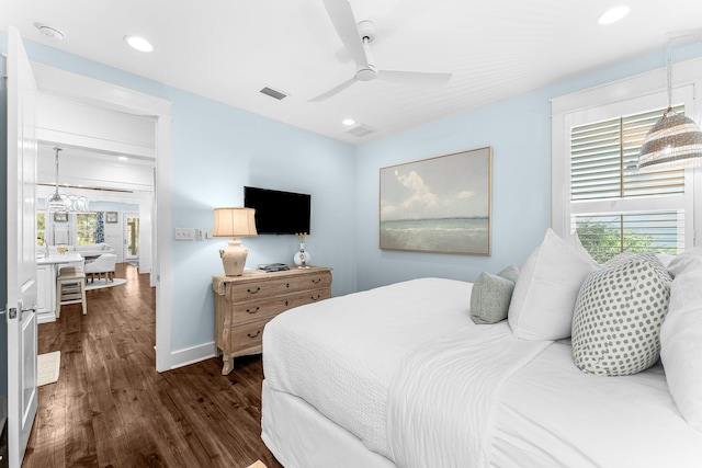 bedroom featuring ceiling fan and dark hardwood / wood-style floors