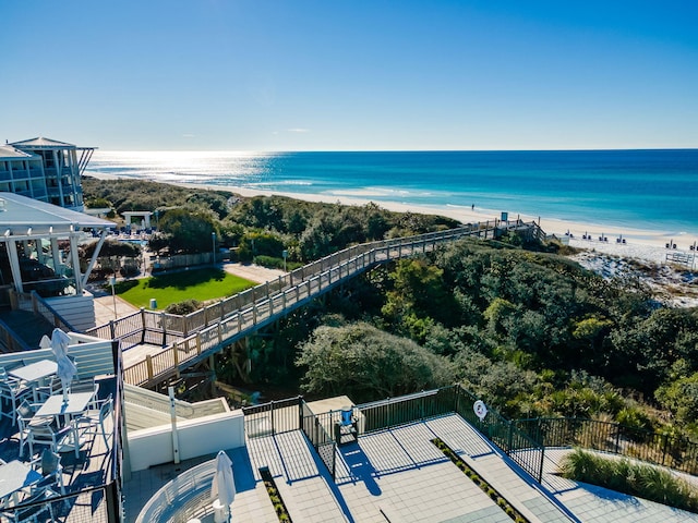 drone / aerial view with a water view and a view of the beach