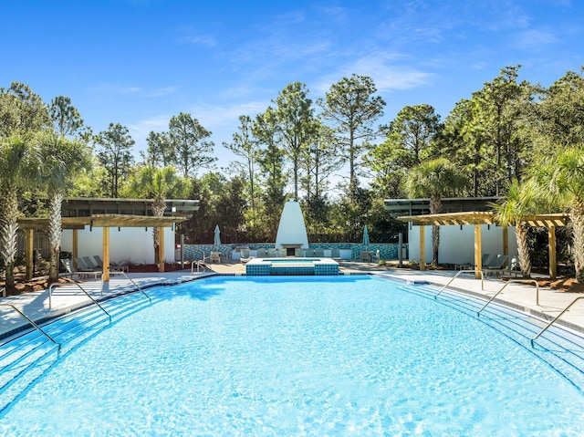 view of pool with a community hot tub and a patio