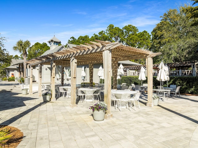 view of community featuring a patio area and a pergola